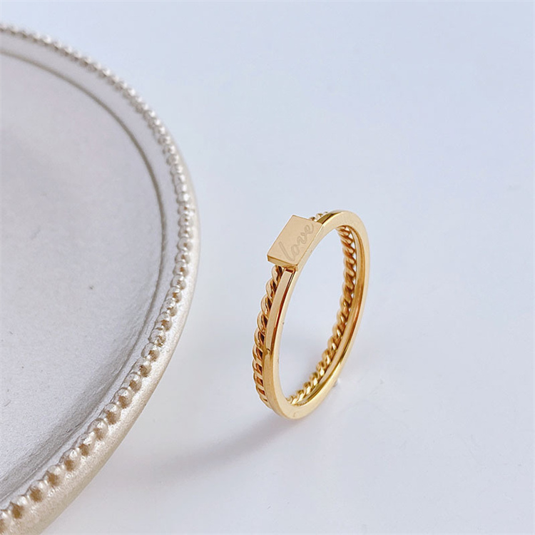 Simple titanium steel ring female twist English brand couple ring niche light luxury ring