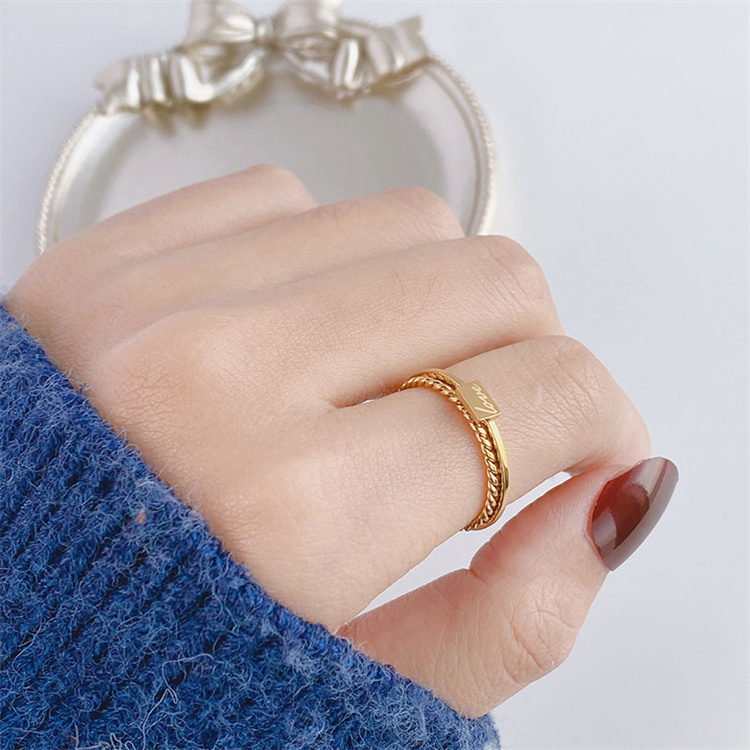 Simple titanium steel ring female twist English brand couple ring niche light luxury ring