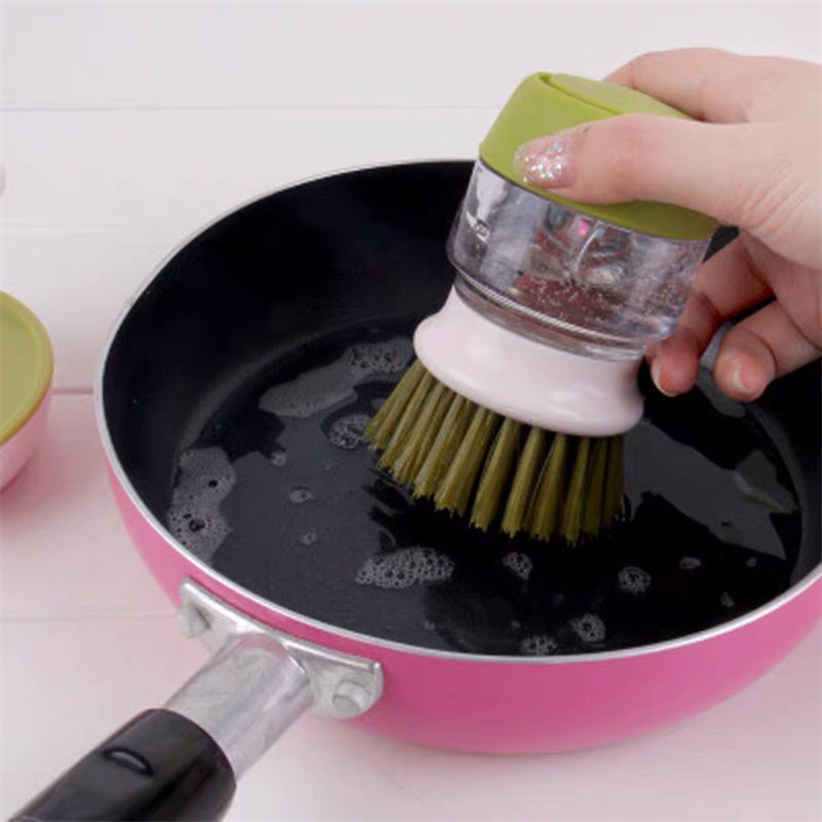 Hand held liquid cleaning brush