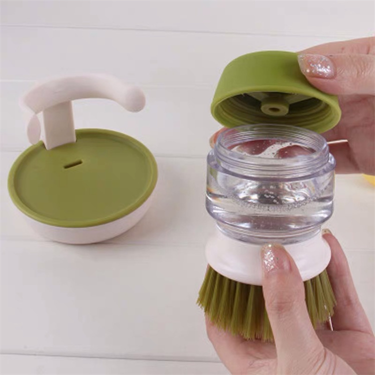 Hand held liquid cleaning brush