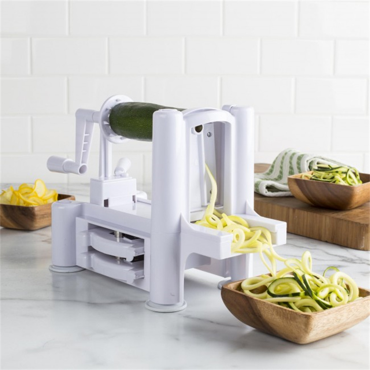 Hand operated spiral shape vegetable cutter